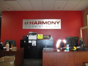 Harmony Logistics logo featured on reception area wall