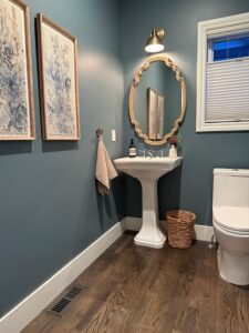 image shows bathroom freshly painted in a blue color