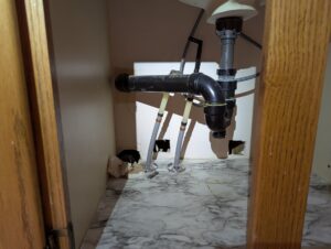 Holes in drywall inside Bathroom vanity