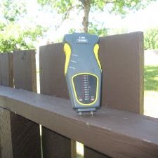 Testing Fence with Moisture meter tester